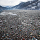Plastic bottles and other waste float on Potpecko lake in Serbia.